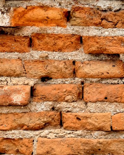 Old red brick wall for background.